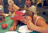 Girl Eating a tomato wrap