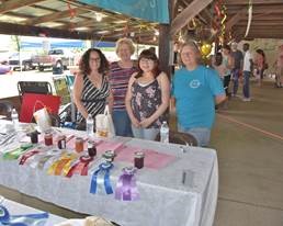 Volunteers at award table